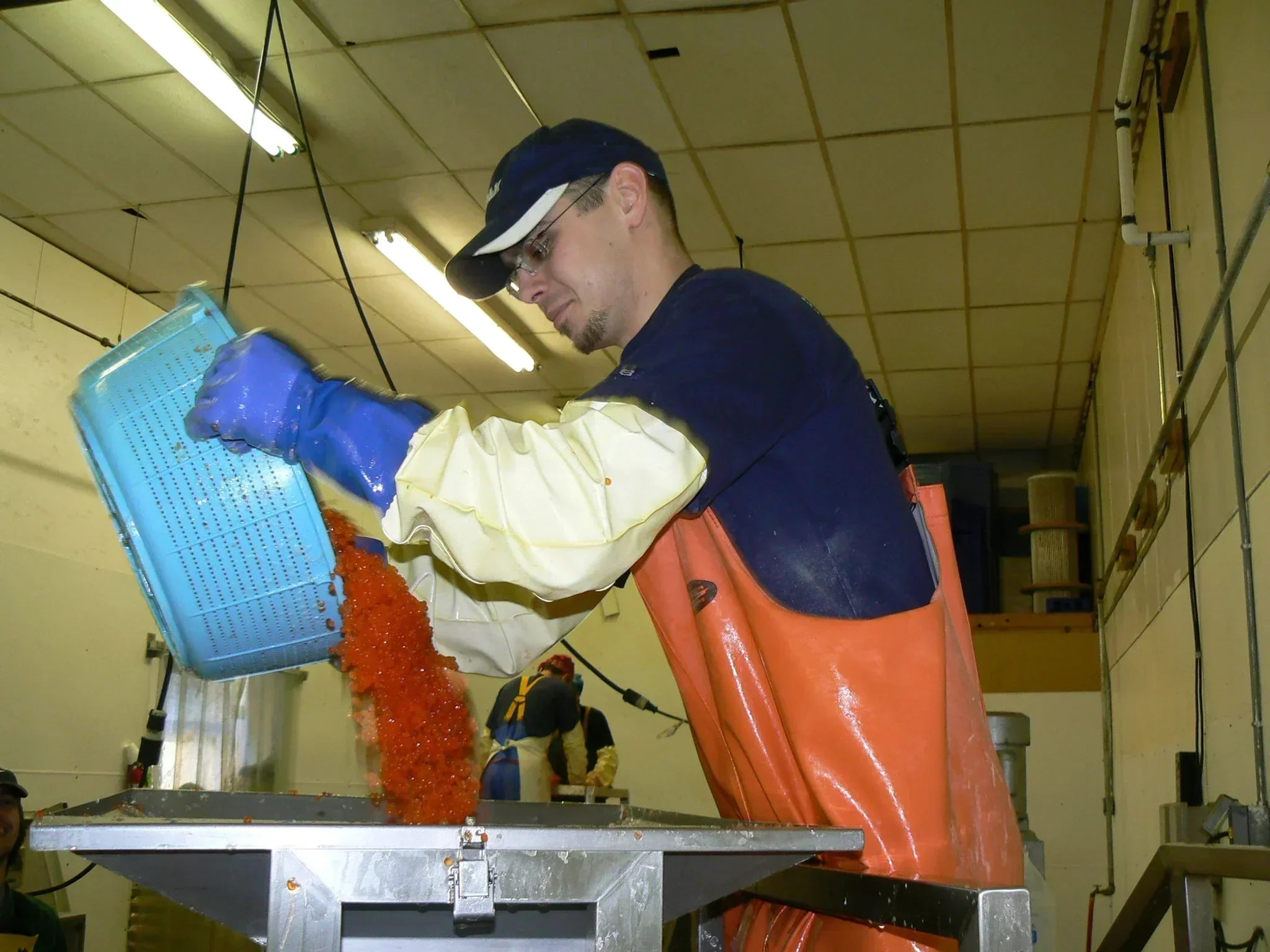 Alaska Fresh Seafood owner, Juro, holding a tray of keta caviar
