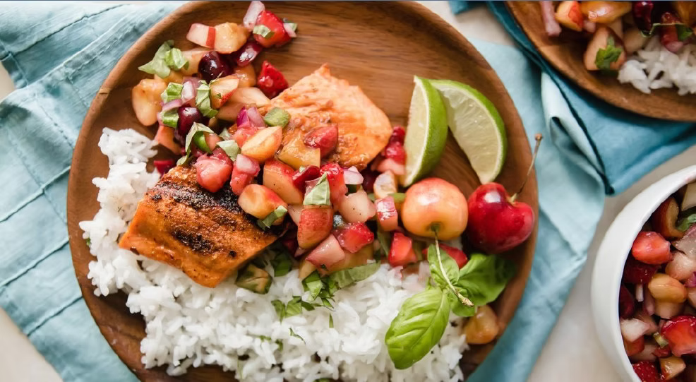 Grilled Copper River Sockeye Salmon with Stonefruit Salsa on a wooden plate