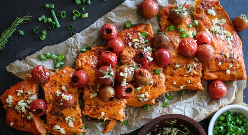 Juicy blistered tomatoes meet buttery salmon in this easy, elegant recipe—perfect for savoring summer’s best flavors.