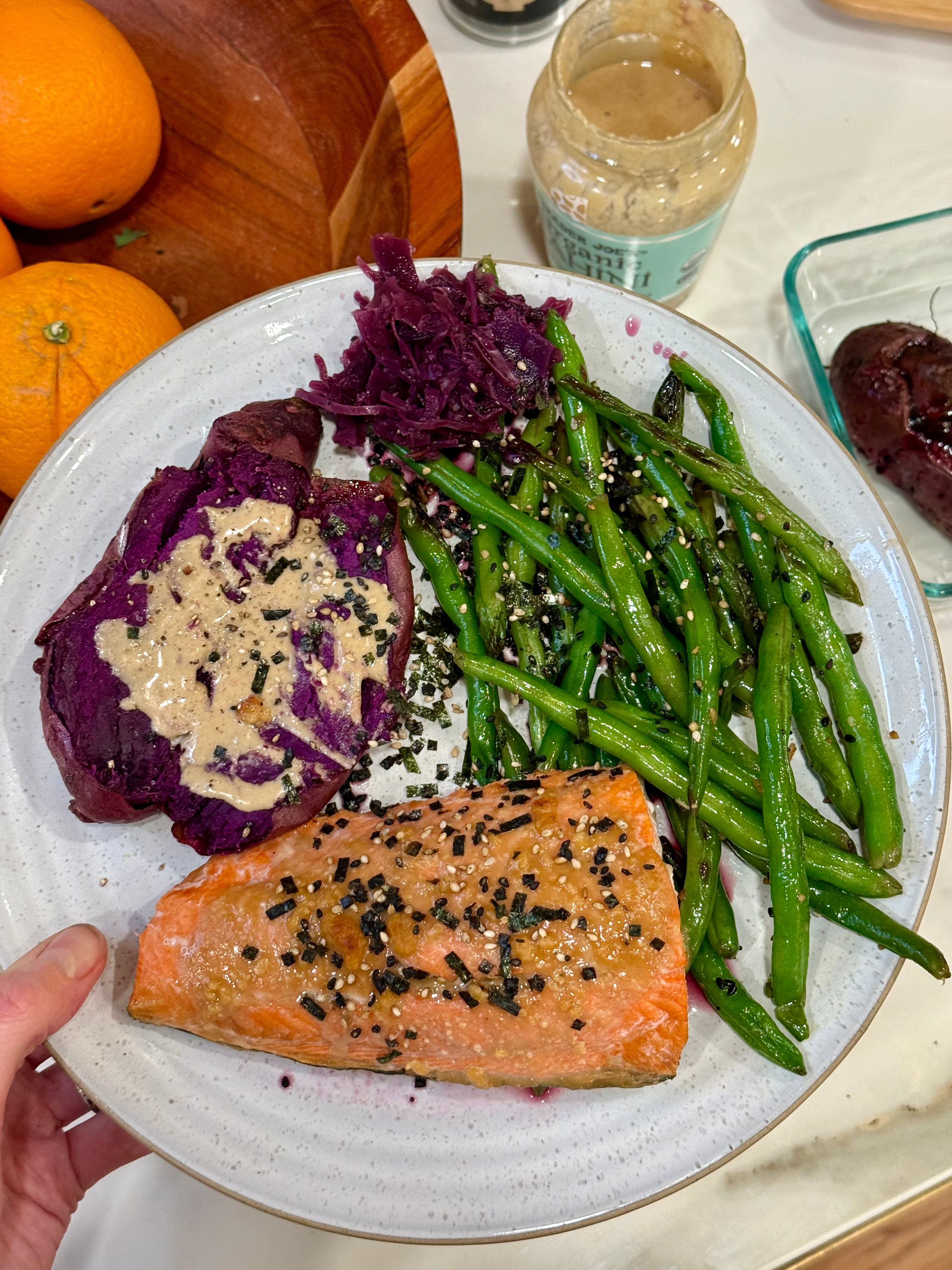 Miso salmon with purple potatoes, tahini drizzle and green beans